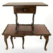 A reproduction coffee table with red leather inset panel and matching table beneath,