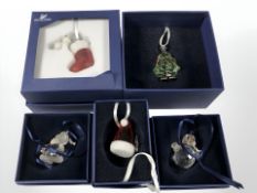 A group of Swarovski crystal Christmas ornaments, all boxed.