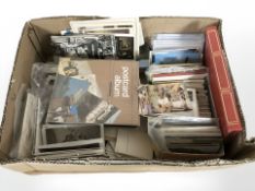 A large quantity of 20th century monochrome and colour postcards.