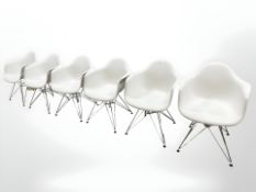 A set of six modern Vitra moulded plastic armchairs on chrome hairpin legs,