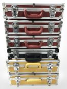 Six various aluminium flight cases, largest 43 cm wide.