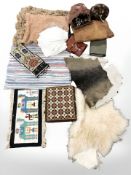 A leather satchel containing a large quantity of knitting needles, leather cushion, fur muff,