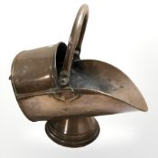 A Victorian copper coal scuttle.