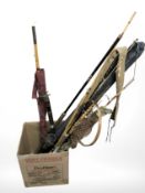 A group of vintage and modern fishing rids,