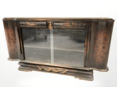 A continental stained beech sliding glass door sideboard,