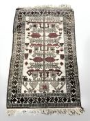 An Afghan/Caucasian rug,