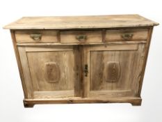 A 19th century pine sideboard, fitted three drawers and cupboards beneath, 138 cm x 52 cm x 94 cm.