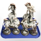 Six Capodimonte G Armani figures including boys playing musical instruments.