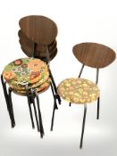 Five Scandinavian curved and laminated dining chairs on metal legs