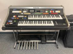 A Technics PCM Sound C600 two manual pedal organ, with carry case and gig bag, width 110 cm.