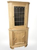 A Danish blonde oak and leaded glass corner cabinet, height 178 cm.