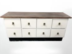 A painted eight drawer low sideboard, 175 cm x 54 cm x 79 cm.