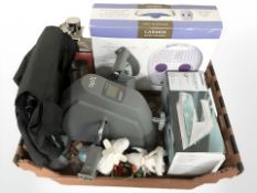 A boxed foot massager, iron, a pedal exerciser, contemporary lantern, etc.