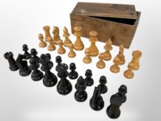A turned and stained boxwood chess set, kings 9.5 cm.