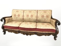 A continental heavily carved beech three seater settee, 190 cm wide,