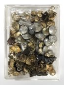 A quantity of military buttons and badges.