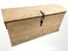 A 19th century pine dome top chest, 124 cm x 59 cm x 61 cm.