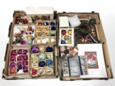 A quantity of vintage Christmas decorations including baubles, a painted cast metal tree stand, etc.