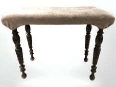 An early 20th century rectangular stool on turned legs, width 64 cm.