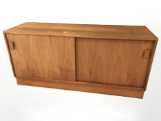 A Danish teak sliding door low sideboard,