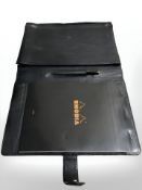 A Penhaligon's black leather writing satchel.