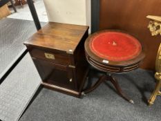 A reproduction mahogany drum table and a brass mounted bedside cabinet