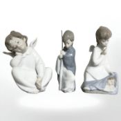 A Lladro figure 'Angel Dreaming' No. 4961, boxed, and two further Lladro figures.