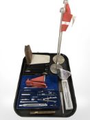 An amethyst geode specimen, precision drawing instruments, Parker pen, two Danish desk flagpoles,