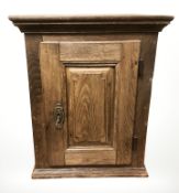 A 19th century oak single door wall cabinet, width 50 cm.
