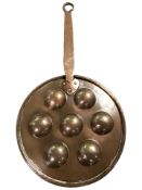 An antique copper frying pan, length 56 cm.