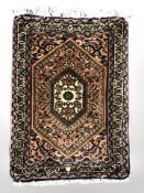 A small Iranian mat, 57 cm x 38 cm.