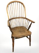 An elm spindle back windsor armchair, width 60 cm.