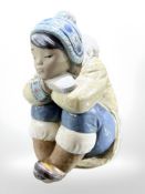 A Lladro figure of a crouching eskimo, height 17 cm.