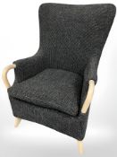 A contemporary Danish armchair in grey fabric