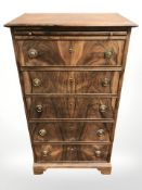 An early 20th century rosewood five drawer tall boy, 64 cm x 39 cm x 119 cm.