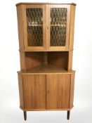 A Danish teak corner cabinet, height 171 cm.