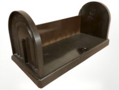 An Ebco Bakelite book trough, width 49 cm.