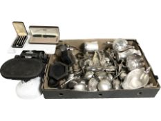 A set of enameled scales, cast iron weights, various silver plated wares and cutlery.