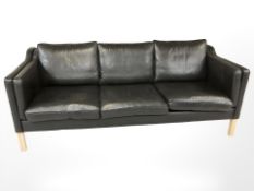 A late 20th century Danish black leather three seater settee,