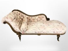 A Victorian carved walnut chaise longue,