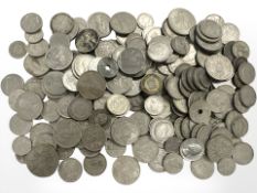 A large quantity of world coins, mostly cupro-nickel, two shillings, quarter dollars,