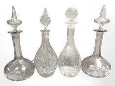 A group of four glass decanters, tallest 33 cm.