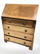 A reproduction mahogany four drawer writing bureau, 76 cm x 47 cm x 100 cm.