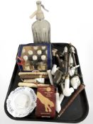 A group of pipes, boxed set of Snapse miniatures, several cigars, a Schweppes soda siphon, etc.