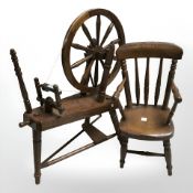 A miniature spindle back armchair and a further spinning wheel, height 35 cm.