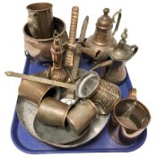 A group of graduated copper measures, skillet, Turkish coffee pots, etc.