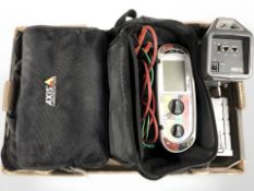 An Axis T8415 wireless install tool and a Megger MFT1731 tester with carry bags and leads.