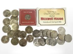 A Queen Elizabeth II £1 coin, Isle of Man one pound piece,