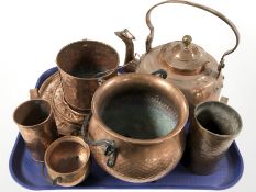 A 19th century copper tea pot, cauldron, dishes, tankards, etc.
