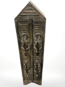 An African style carved wooden CD storage tower, height 100 cm.
